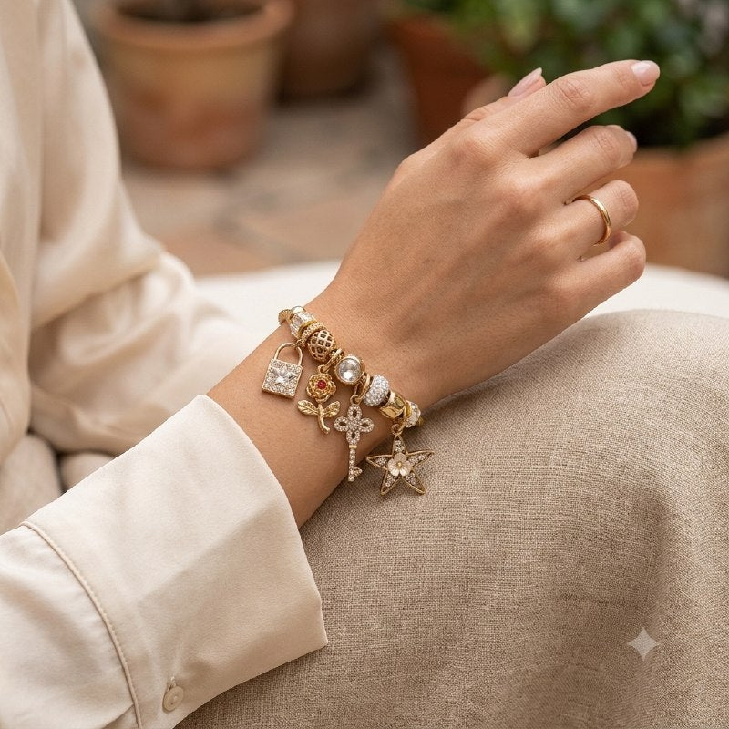 PULSERA DE ENCHAPE PARA DAMA CON DISEÑO DE ESTRELLA DE MAR, CANDADO Y FLOR