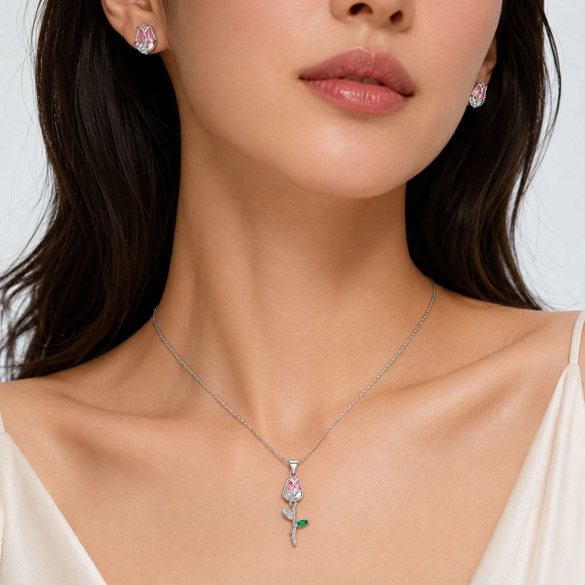 SET DE ENCHAPE PARA DAMA CON DISEÑO DE ROSA CON CRISTAL ROSADO Y HOJA VERDE