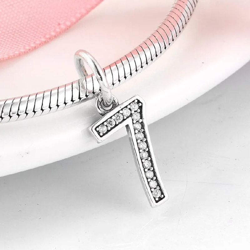 PCHARM4065$7 NUMERO 7 PANDORA PLATA 9.25