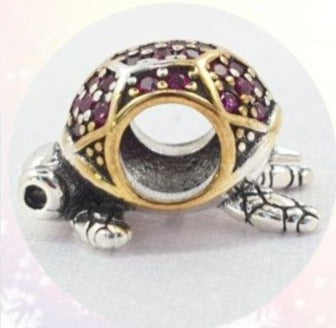 PCHARM2670 TORTUGA CON CIRCONES AZULES Y ROJOS