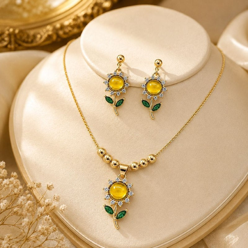 SET DE ENCHAPE PARA DAMA CADENA, DIJE Y ARETES GIRASOL EN 2 COLORES