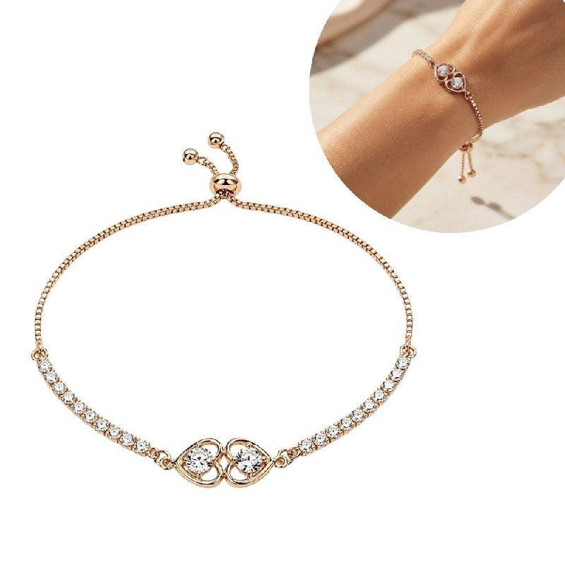 PULSERA DE ENCHAPE PARA DAMA CON DISEÑO DE CORAZONES ENTRELAZADOS Y CIRCONES