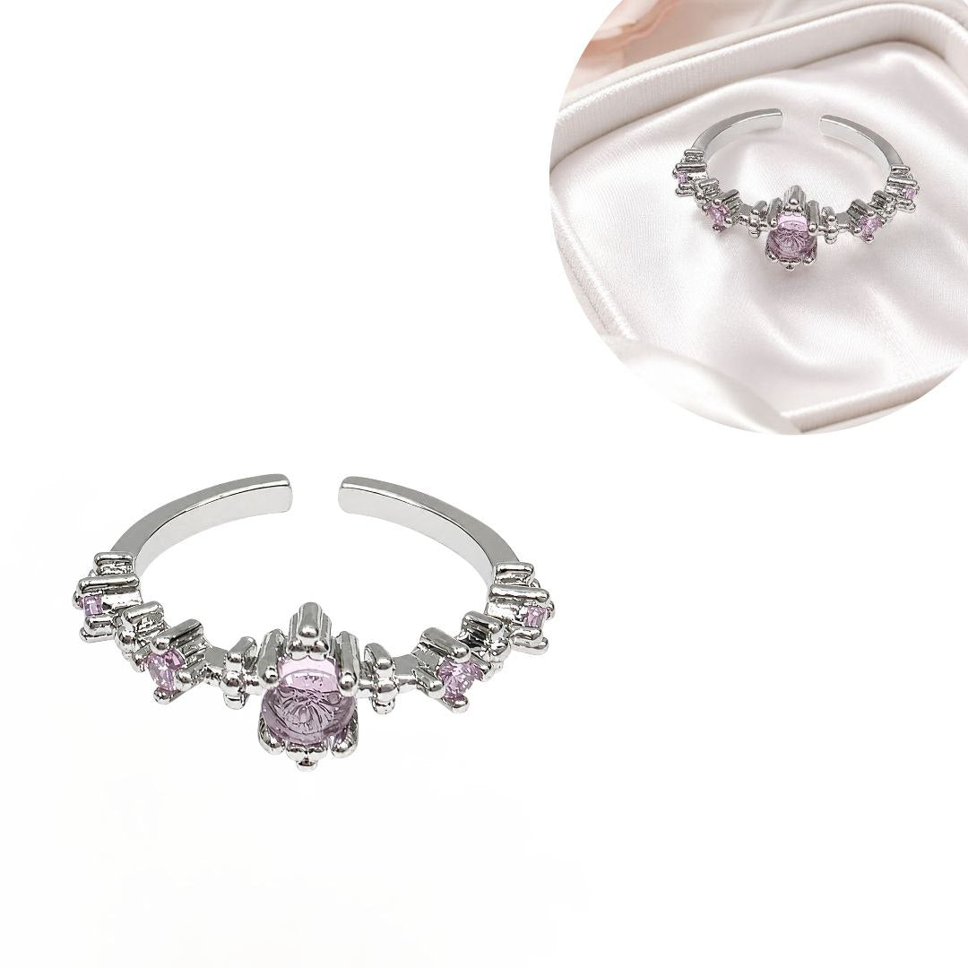 ANILLO DE ENCHAPE PARA DAMA CON CIRCONES ROSADOS Y ACABADO PLATEADO