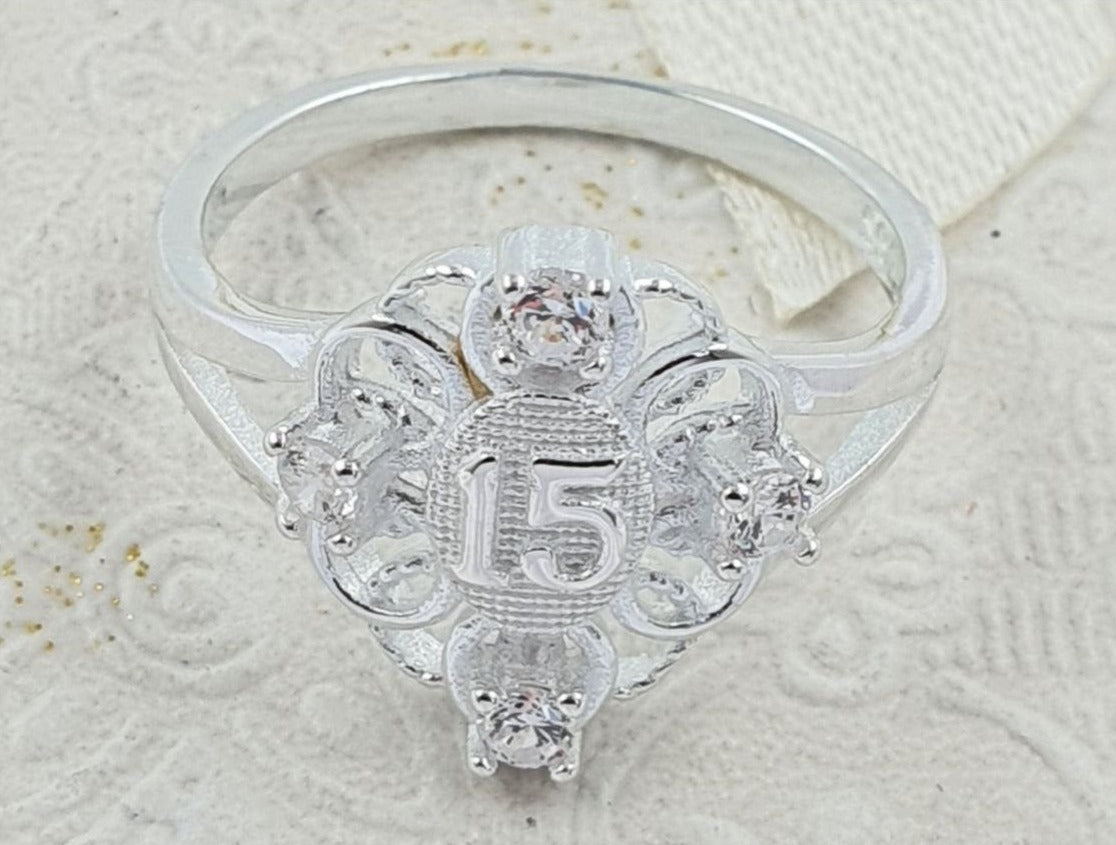PANI1702B ANILLO 15 AÑOS OVALADO PIEDRAS BLANCAS,  PLATA 925